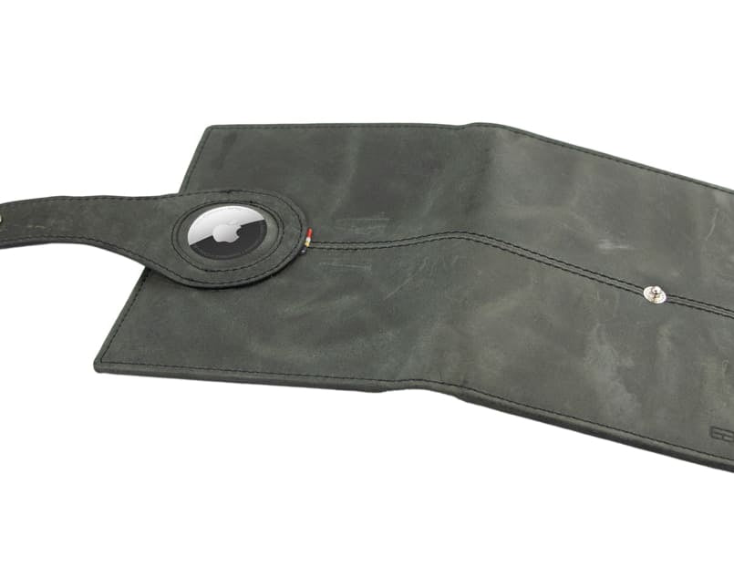 Open outside view with AirTag of the AirTag Passport Holder in Brushed Brushed Black.