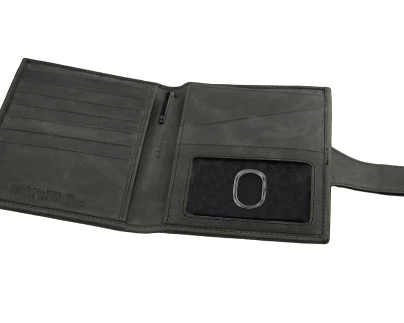 Open inside view with AirTag of the AirTag Passport Holder in Brushed Brushed Black.
