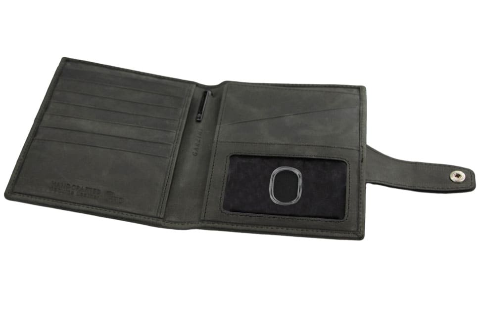 Open inside view with AirTag of the AirTag Passport Holder in Brushed Brushed Black.