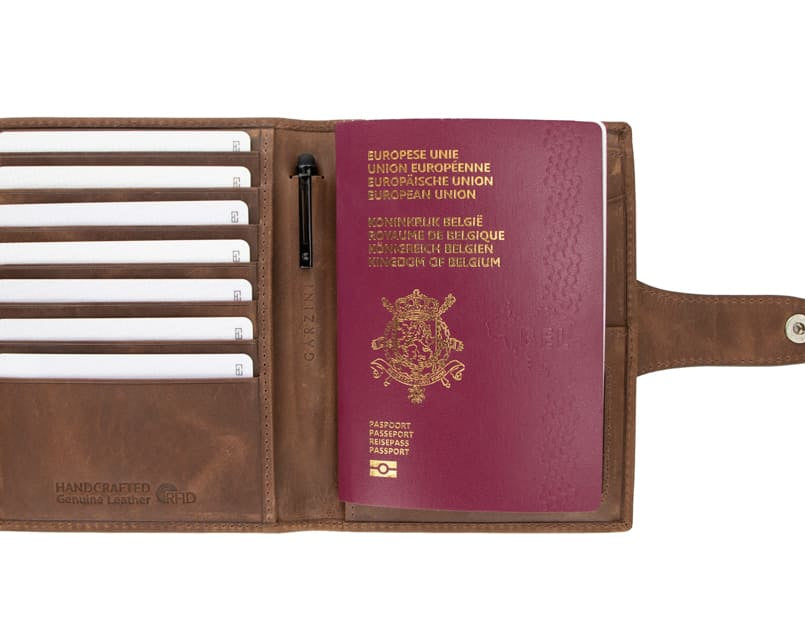 Open view of the AirTag Passport Holder in Brushed Brushed Brown with cards and passport inside.