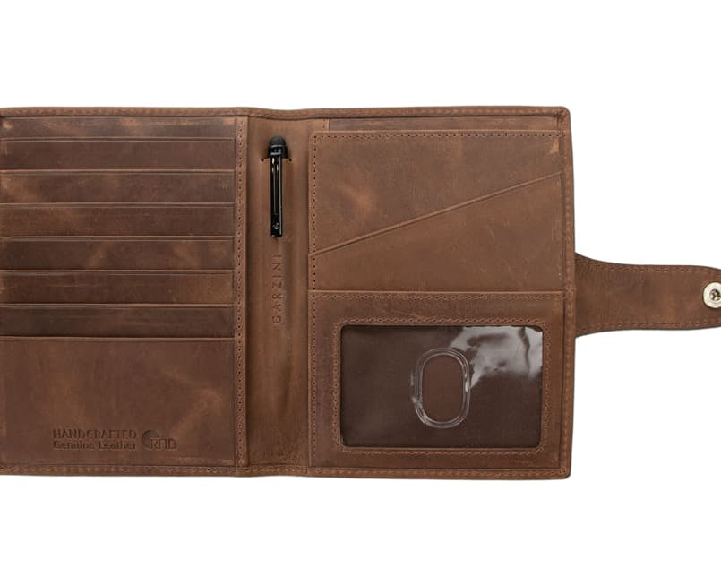 Open view of the AirTag Passport Holder in Brushed Brushed Brown with no cards.