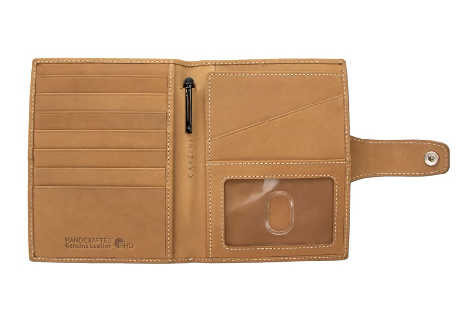 Open view of the AirTag Passport Holder in Vintage Camel Brown with no cards.