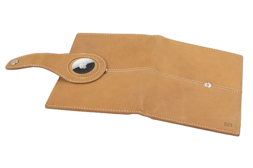 Open outside view with AirTag of the AirTag Passport Holder in Vintage Camel Brown.