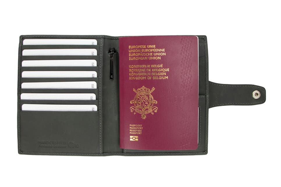 Open view of the AirTag Passport Holder in Vintage Carbon Black with cards and passport inside.
