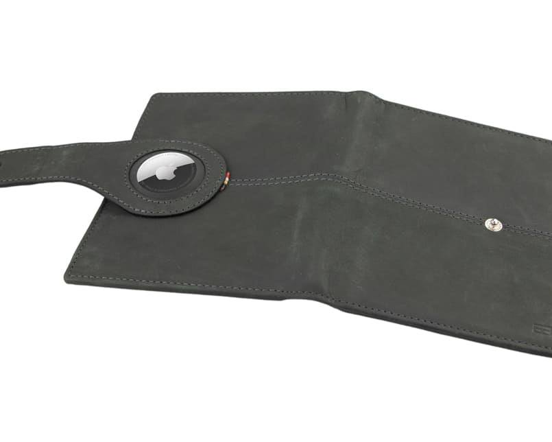 Open outside view with AirTag of the AirTag Passport Holder in Vintage Carbon Black.