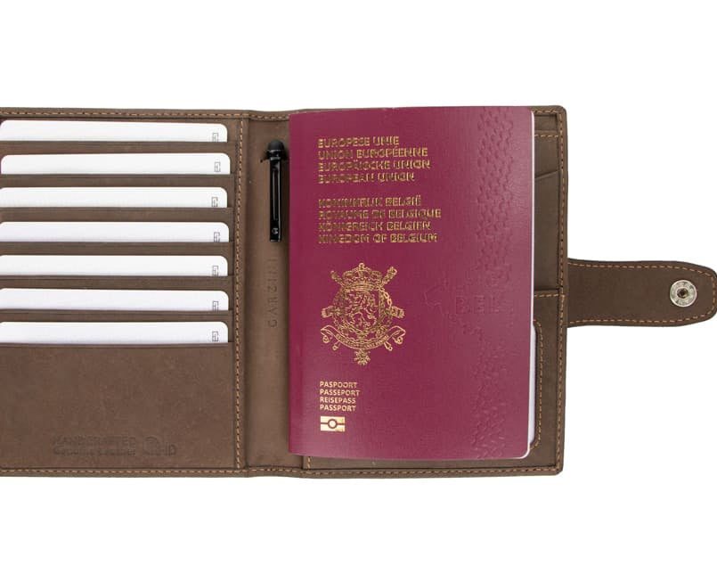Open view of the AirTag Passport Holder in Vintage Java Brown with cards and passport inside.