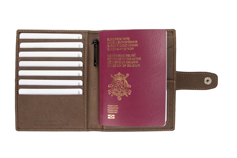 Open view of the AirTag Passport Holder in Vintage Java Brown with cards and passport inside. 