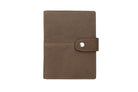 Frontview of the AirTag Passport Holder in Vintage Java Brown.