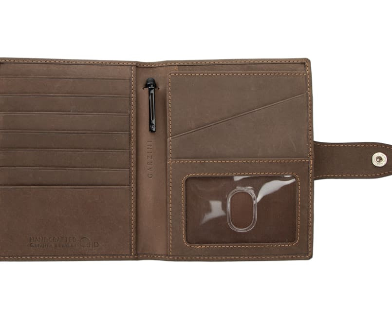 Open view of the AirTag Passport Holder in Vintage Java Brown with no cards.