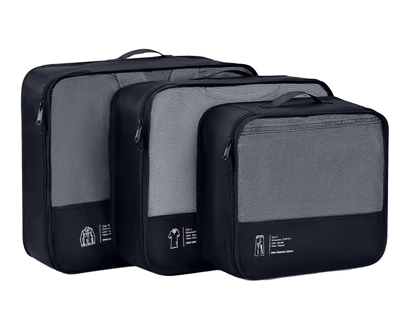 Three black Garzini packing cubes stacked together