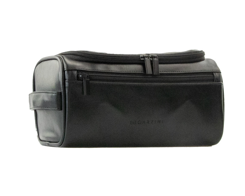 Black Garzini Toiletry Bag angled front side view, showing premium craftsmanship and convenient zipper placement.