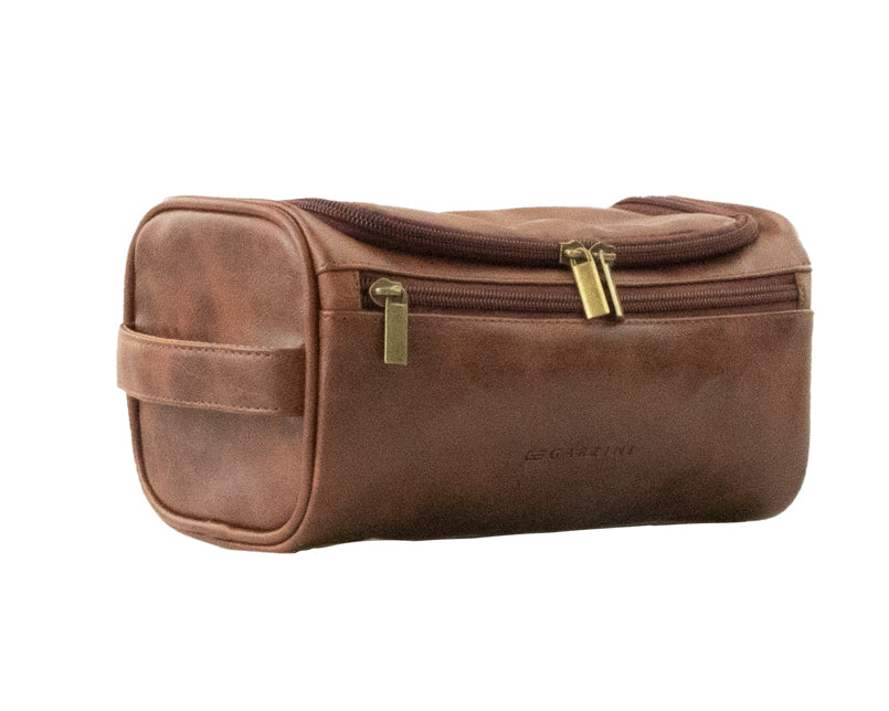Brown Garzini Toiletry Bag angled front side view, combining classic style and convenient zipper design for travel essentials.