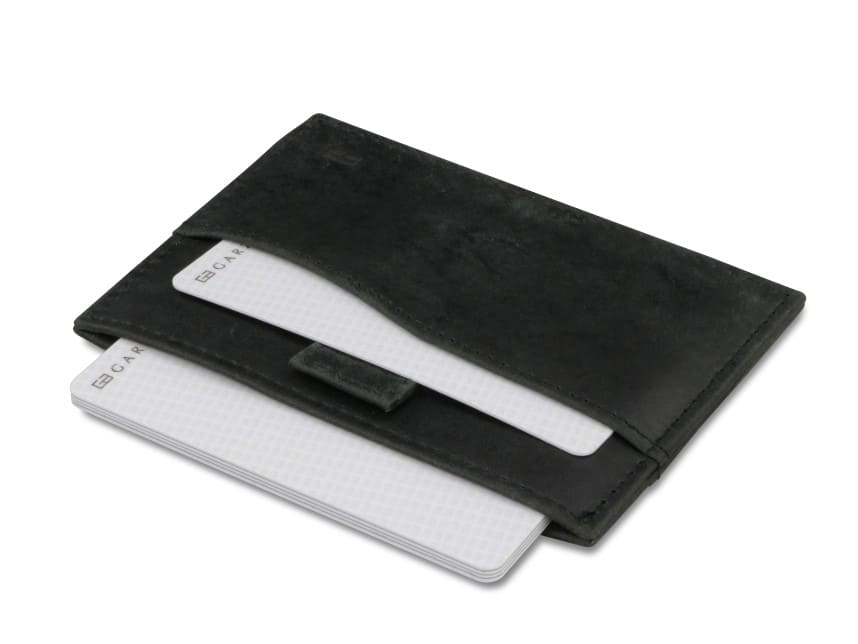 Open Leggera Card Holder Brushed in Brushed Black with cards pulling out.