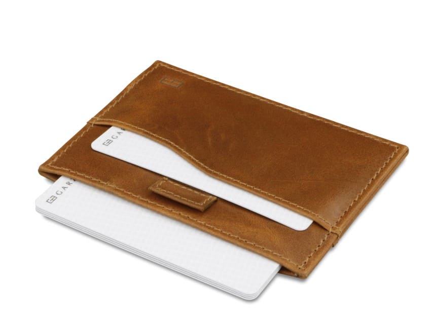 Open Leggera Card Holder Brushed in Brushed Cognac with cards pulling out.