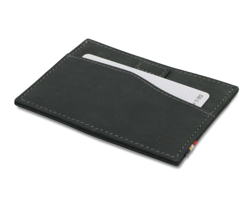Front view of Leggera Card Holder Vintage in Carbon Black with a pull tab with a card.