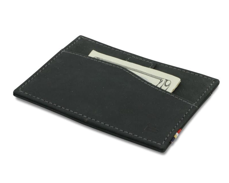 Front view of Leggera Card Holder Vintage in Carbon Black with a pull tab with money.