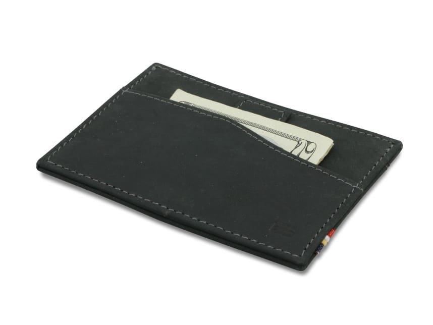 Front view of Leggera Card Holder Vintage in Carbon Black with a pull tab with money.