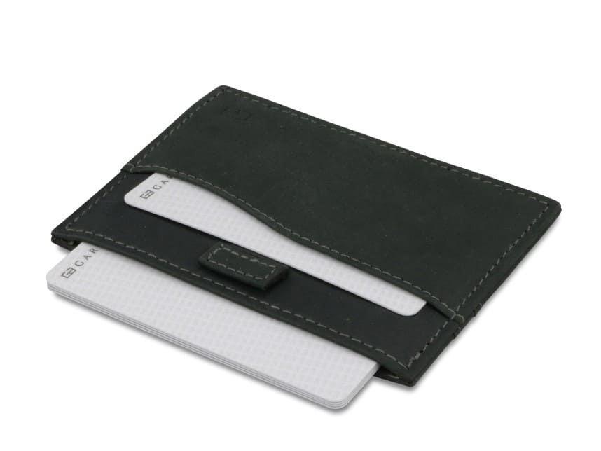 Open Leggera Card Holder Vintage in Carbon Black with cards pulling out.