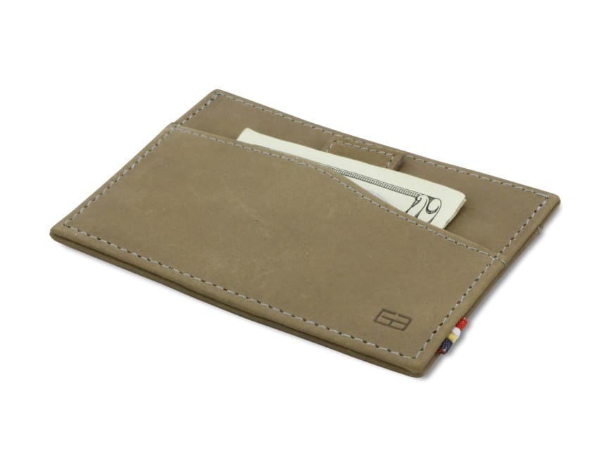 Front view of Leggera Card Holder Vintage in Metal Grey with a pull tab with money.