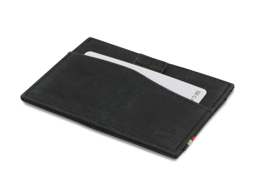 Front view of Leggera Card Holder ID Window Brushed in Brushed Black with a pull tab with a card.