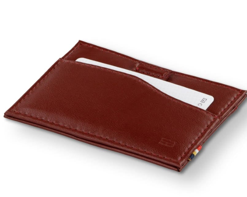 Front view of Leggera Card Holder ID Window Vegan in Cactus Burgundy with a pull tab with a card.