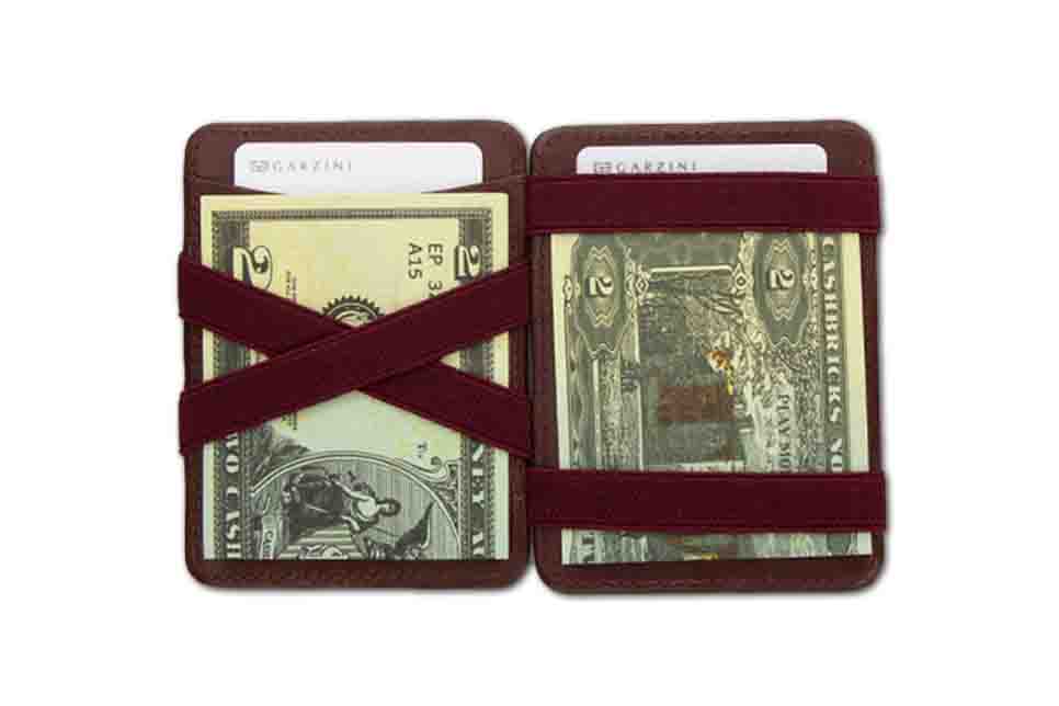 Open view of the Urban Magic Wallet in Burgundy with money. 