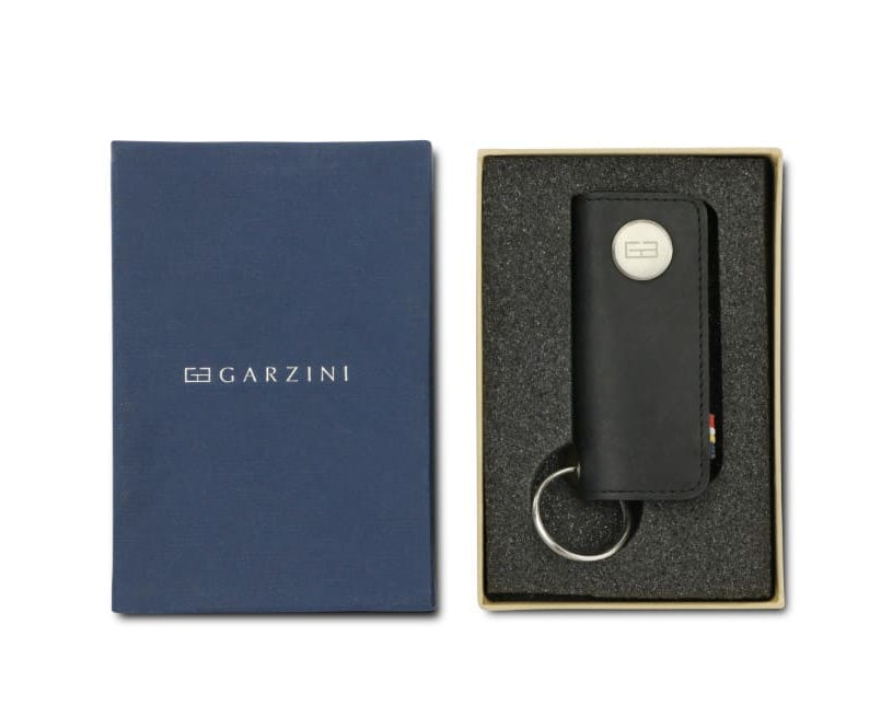 Front view of the Lusso Vintage Key Holder in Brushed Black in the box with the brand name Garzini. 