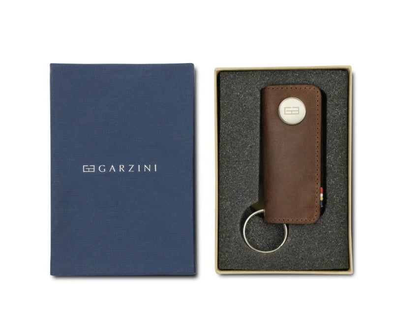 Front view of the Lusso Vintage Key Holder in Brushed Brown in the box with the brand name Garzini. 