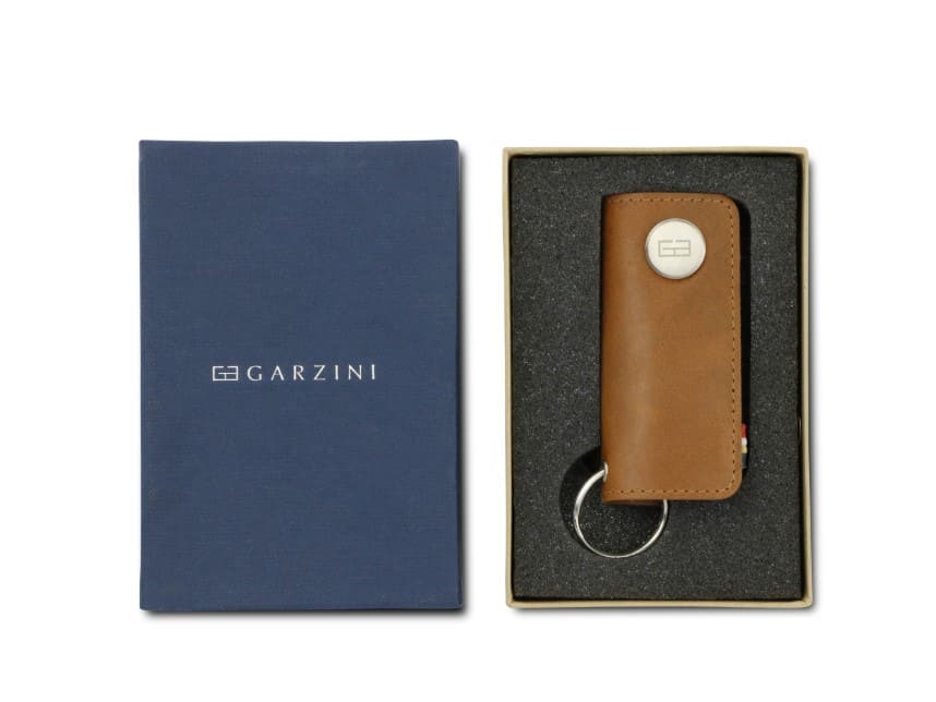 Front view of the Lusso Vintage Key Holder in Brushed Cognac in the box with the brand name Garzini. 