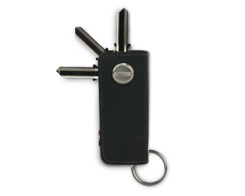 Back view of Lusso Key Holder in Carbon Black with with a key holder ring and 3 keys. 