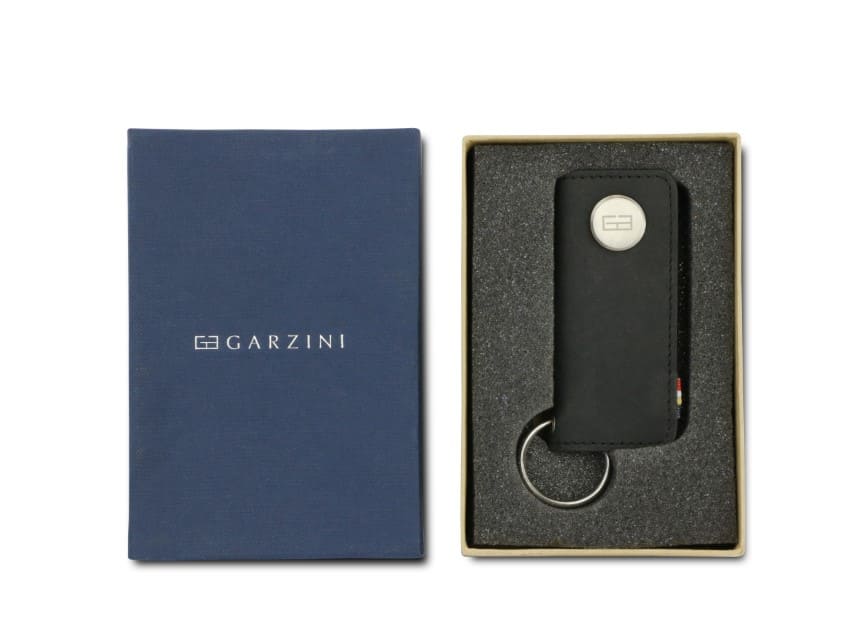 Front view of the Lusso Key Holder in Carbon Black in the box with the brand name Garzini. 