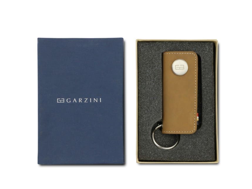Front view of the Lusso Key Holder in Camel Brown in the box with the brand name Garzini. 