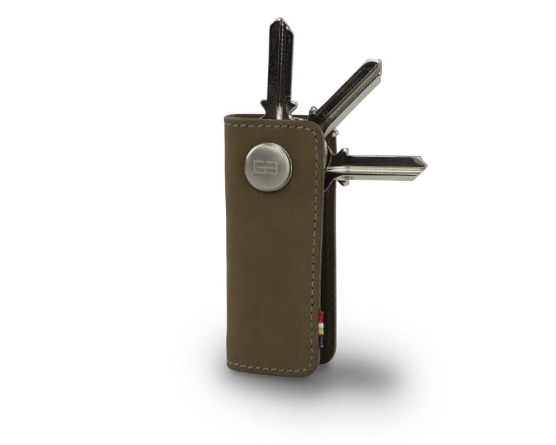 Side view of Lusso Key Holder in Metal Grey with with a key holder ring and 3 keys. 