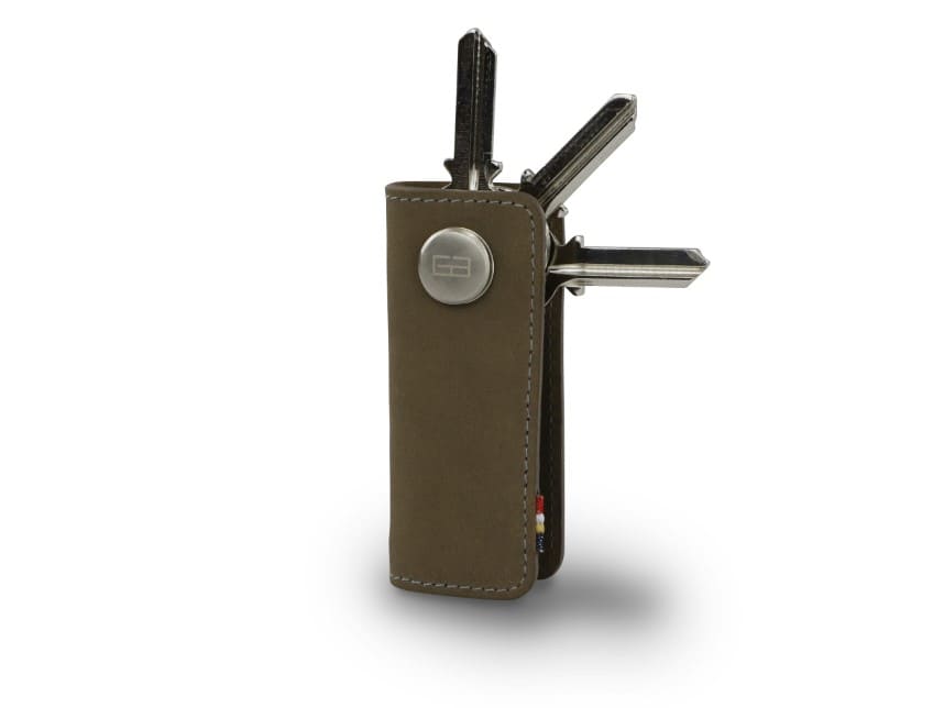 Side view of Lusso Key Holder in Metal Grey with with a key holder ring and 3 keys. 