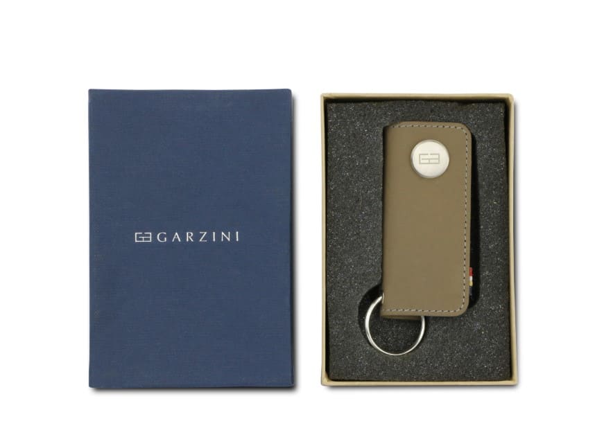 Front view of the Lusso Key Holder in Metal Grey in the box with the brand name Garzini. 