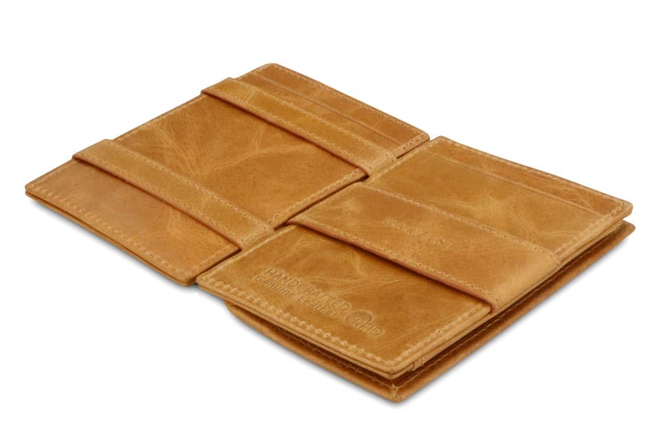 Open view of the  Essenziale Magic Coin Wallet Brushed in Brushed Cognac with the money strap to secure money.