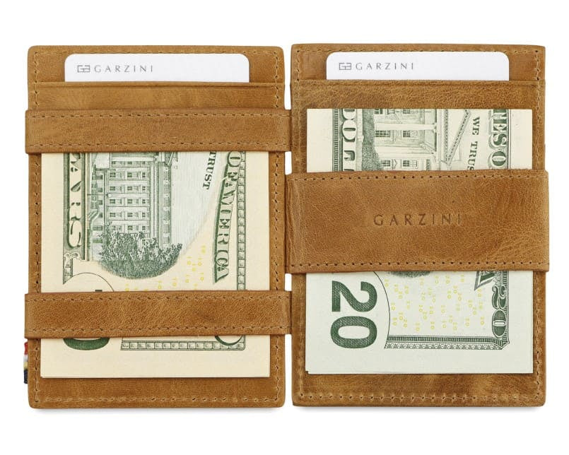 Open view of Cavare Magic Coin Wallet Card Sleeve Brushed  in Brushed Cognac with money inside.