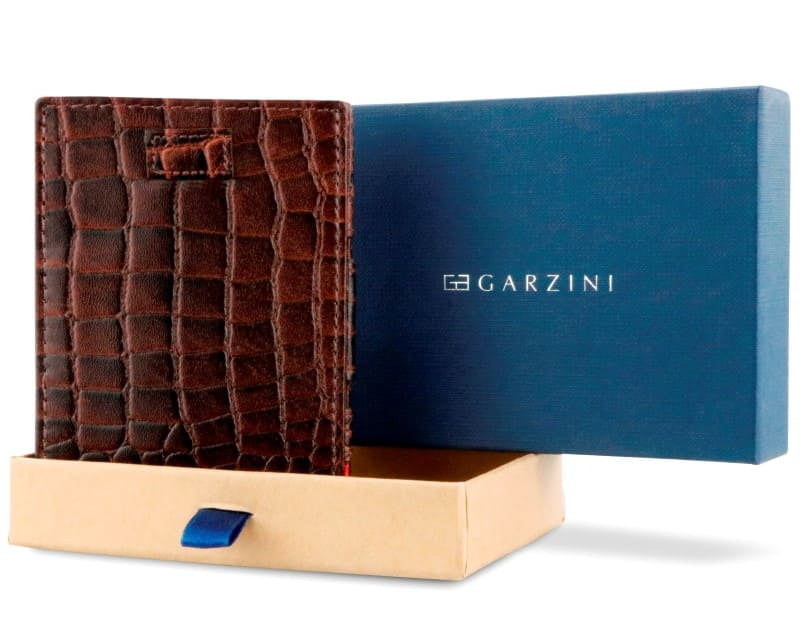 Half-open blue box with Garzini brand name Inside the box, the Brown wallet is wrapped in tissue paper, placed in a light cardboard box with a blue strap.