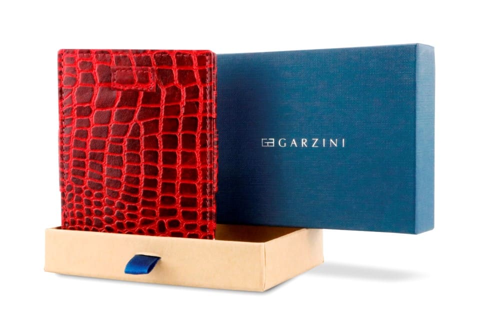 Half-open blue box with Garzini brand name Inside the box, the Burgundy wallet is wrapped in tissue paper, placed in a light cardboard box with a blue strap.
