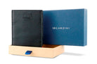 Half-open blue box with Garzini brand name Inside the box, the Raven Black wallet is wrapped in tissue paper, placed in a light cardboard box with a blue strap.