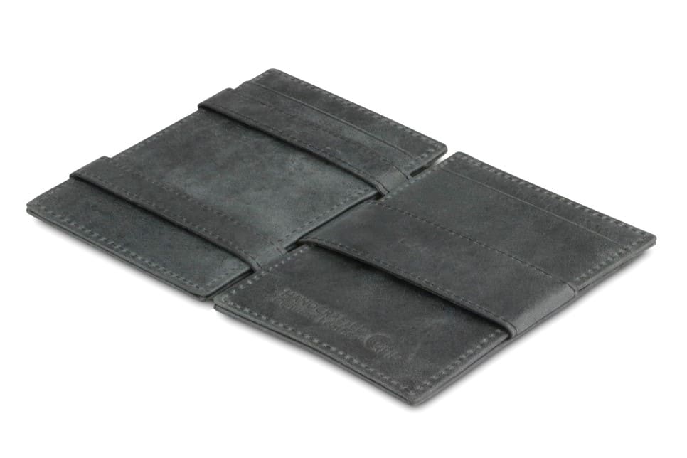 Open view of the Essenziale Magic Wallet ID Window Brushed in Brushed Black with the money strap to secure money.