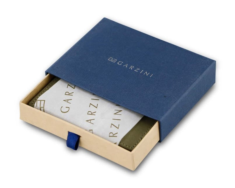 Half-open blue box with Garzini brand name. Inside the box, the Olive Green wallet is wrapped in tissue paper, placed in a light cardboard box with a blue strap