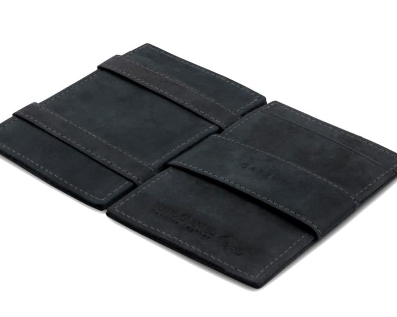 Open Cavare Magic Wallet Vintage  in Carbon Black with pull tab, and money straps.