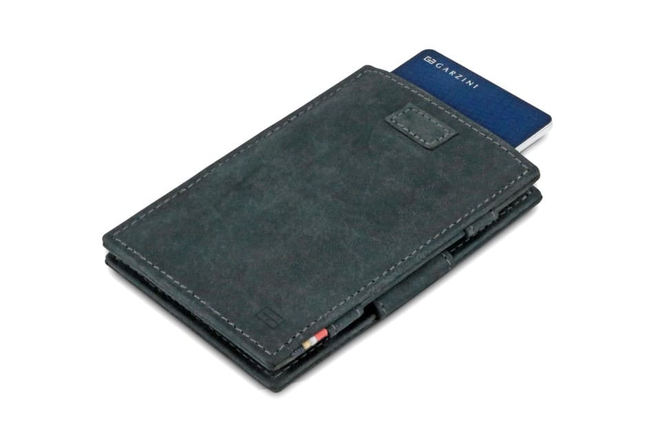 Front view of Cavare Magic Wallet Vintage in Carbon Black with pull tab and card pulling out.