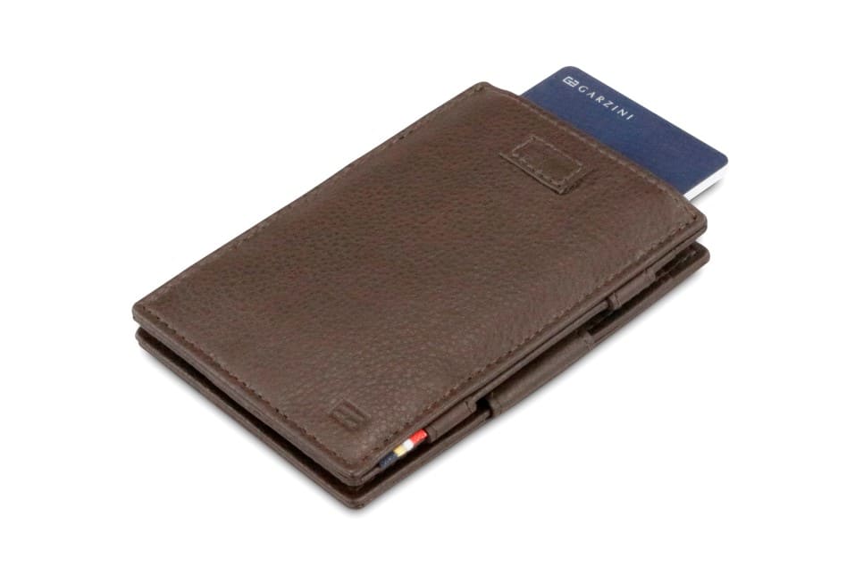 Front view of Cavare Magic Wallet Card Sleeve Nappa in Chocolate Brown with pull tab and card pulling out.