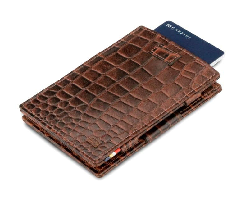 Front view of Cavare Magic Wallet Card Sleeve in Croco Brown with pull tab and card pulling out.