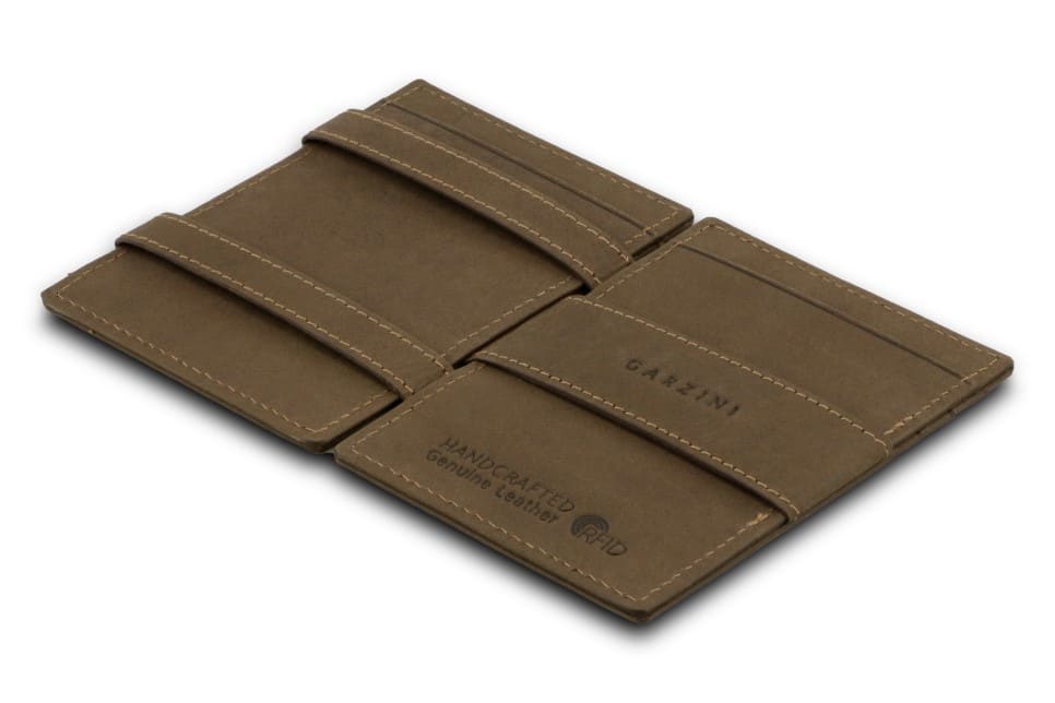 Open Cavare Magic Wallet Vintage  in Java Brown with pull tab and money straps.