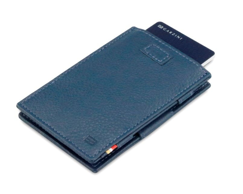 Front view of Cavare Magic Wallet Card Sleeve Nappa in Navy Blue with pull tab and card pulling out.