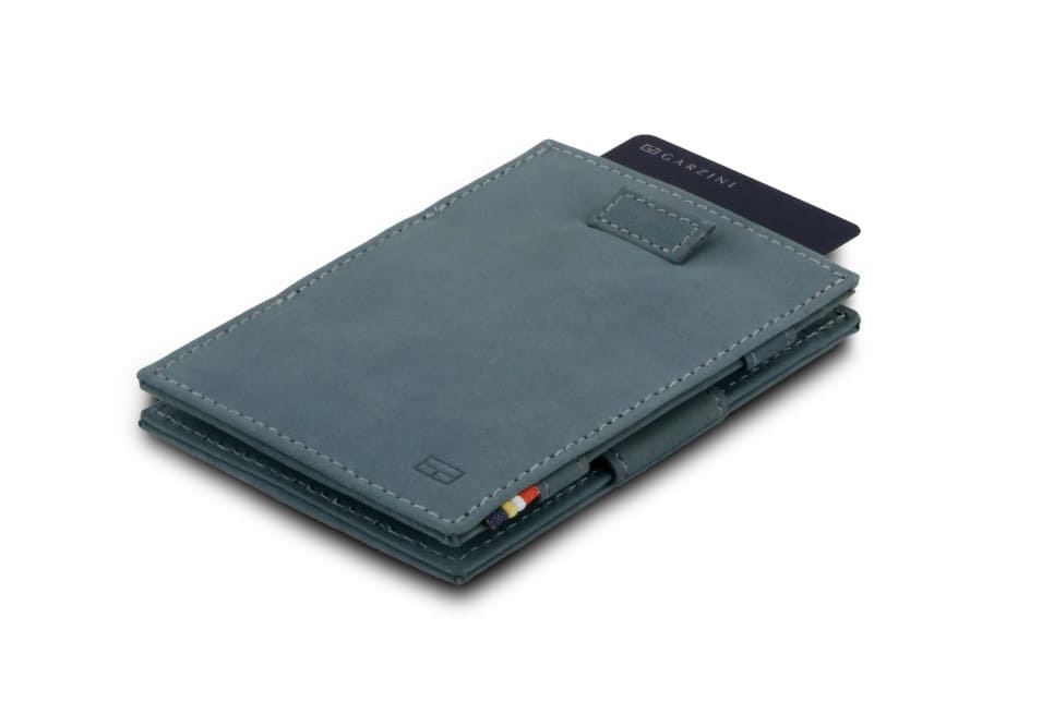 Front view of Cavare Magic Wallet Vintage in Sapphire Blue with pull tab and card pulling out.