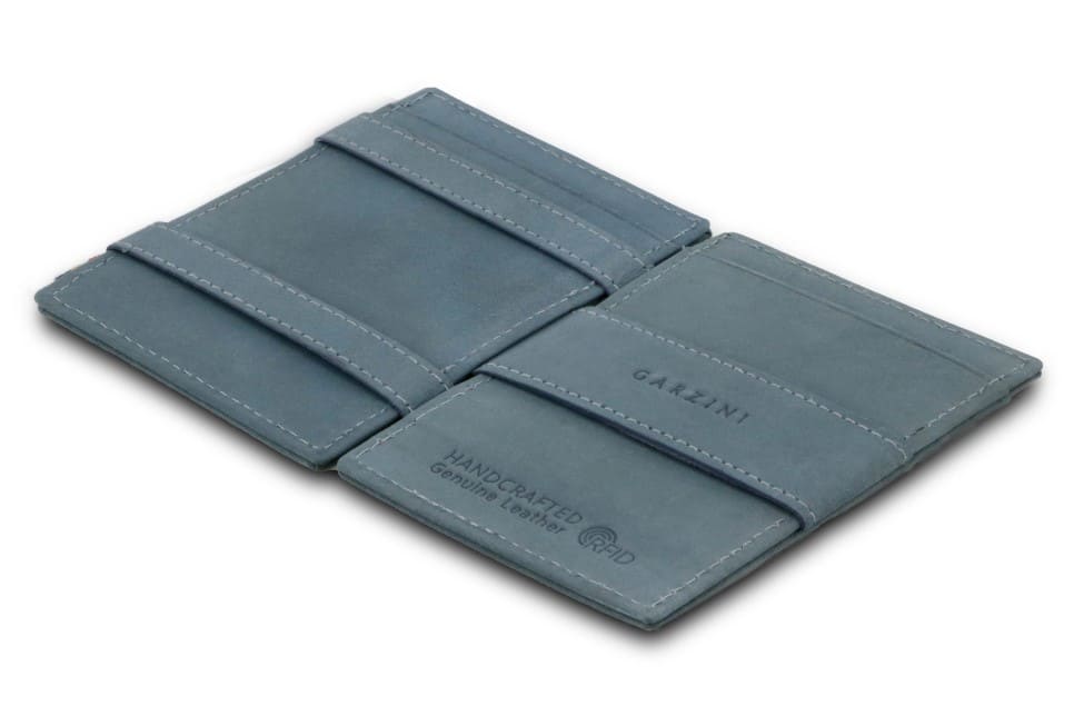 Open Cavare Magic Wallet Vintage in Sapphire Blue with pull tab, and money straps.